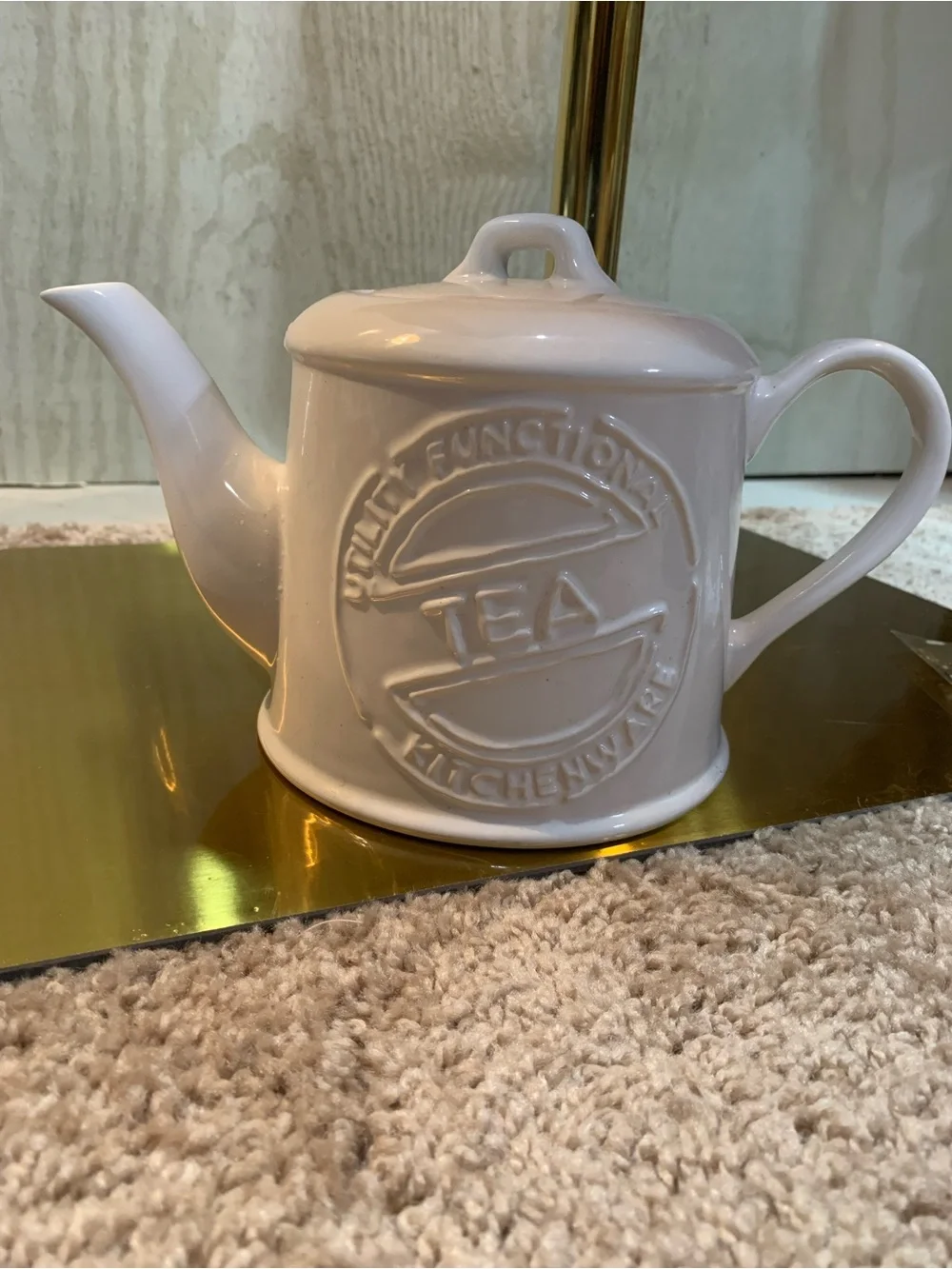 White Ceramic Teapot with Embossed 'Tea' Motif